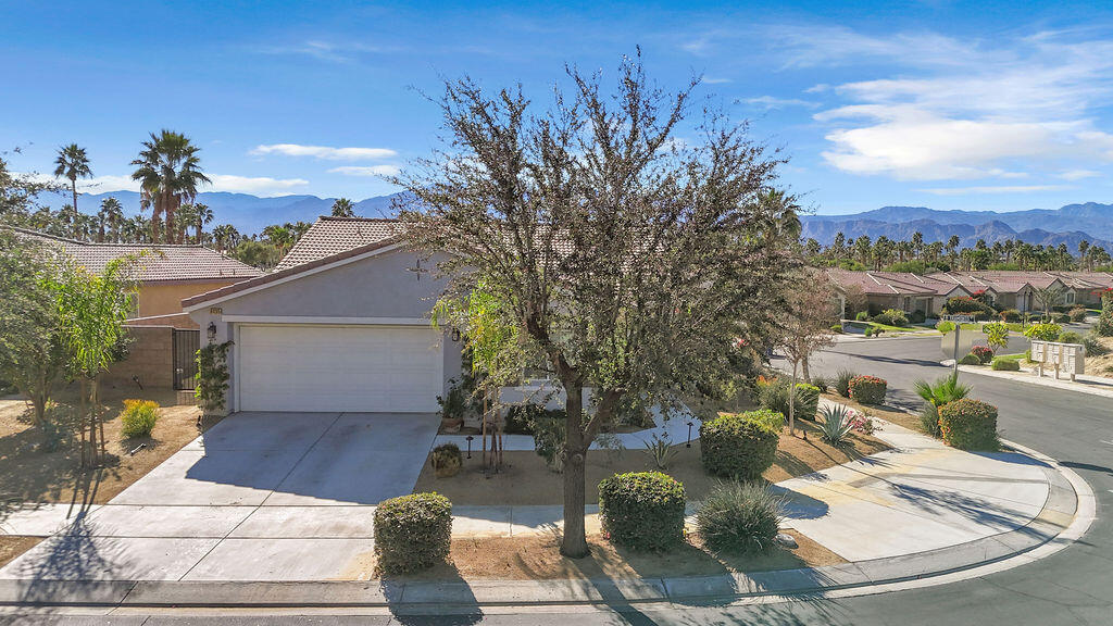 84285 Tramonto Way Indio, CA 92203 - Photo 63 of 63 a view of a patio with couches table and chairs and potted plants