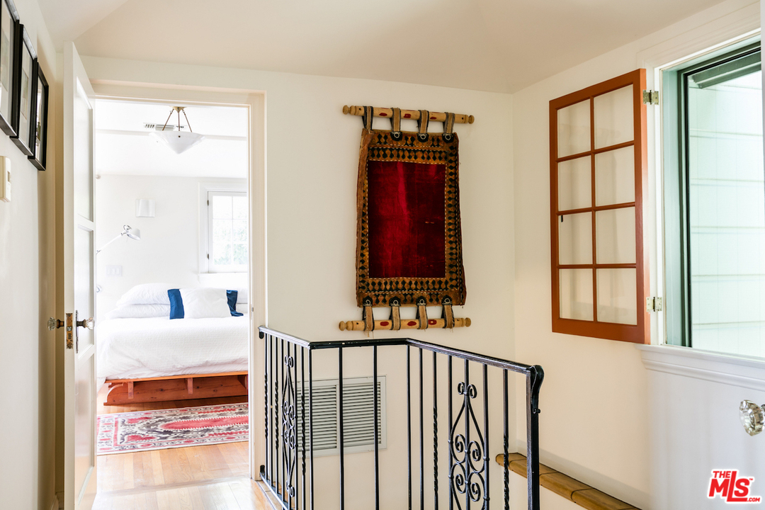 239 West Channel Road Santa Monica, CA 90402 - Photo 17 of 30 a bedroom with furniture and a window