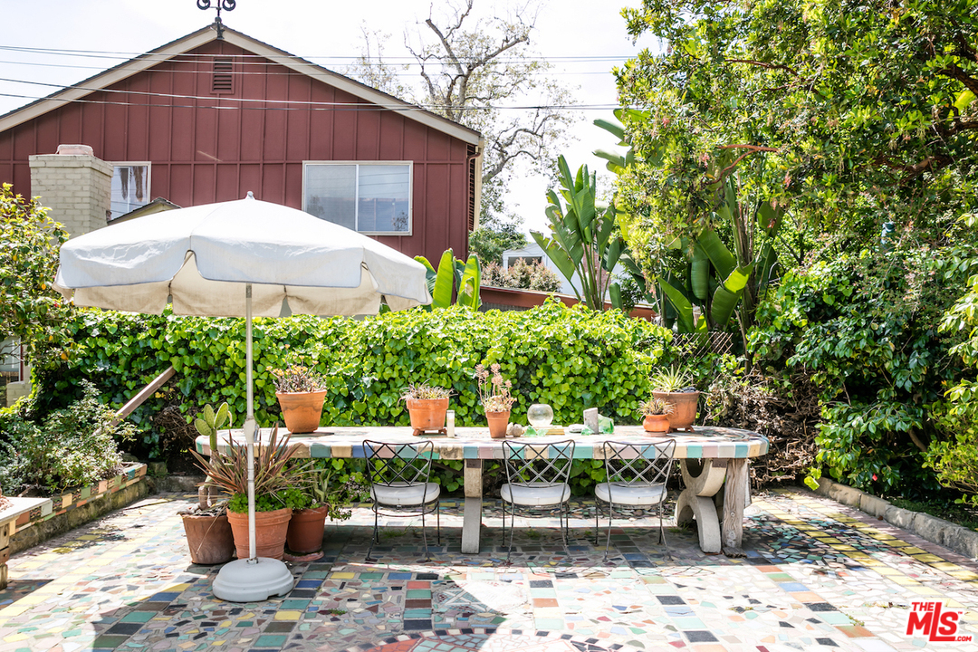 239 West Channel Road Santa Monica, CA 90402 - Photo 25 of 30 a view of a chair and table in backyard