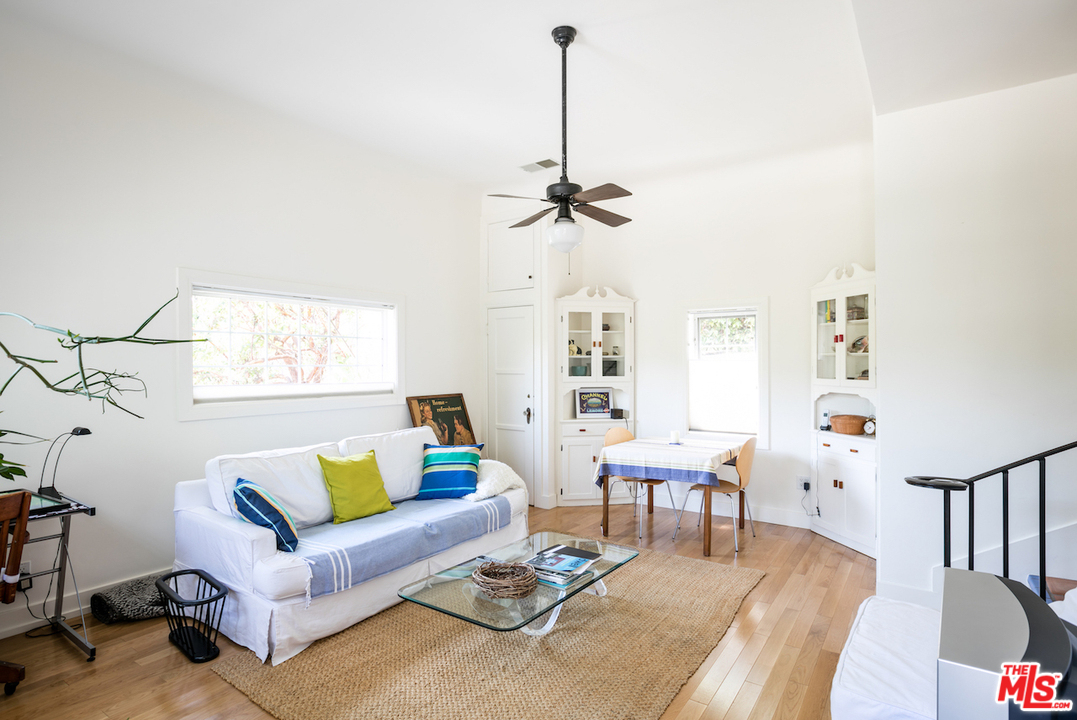 239 West Channel Road Santa Monica, CA 90402 - Photo 26 of 30 a living room with furniture and wooden floor