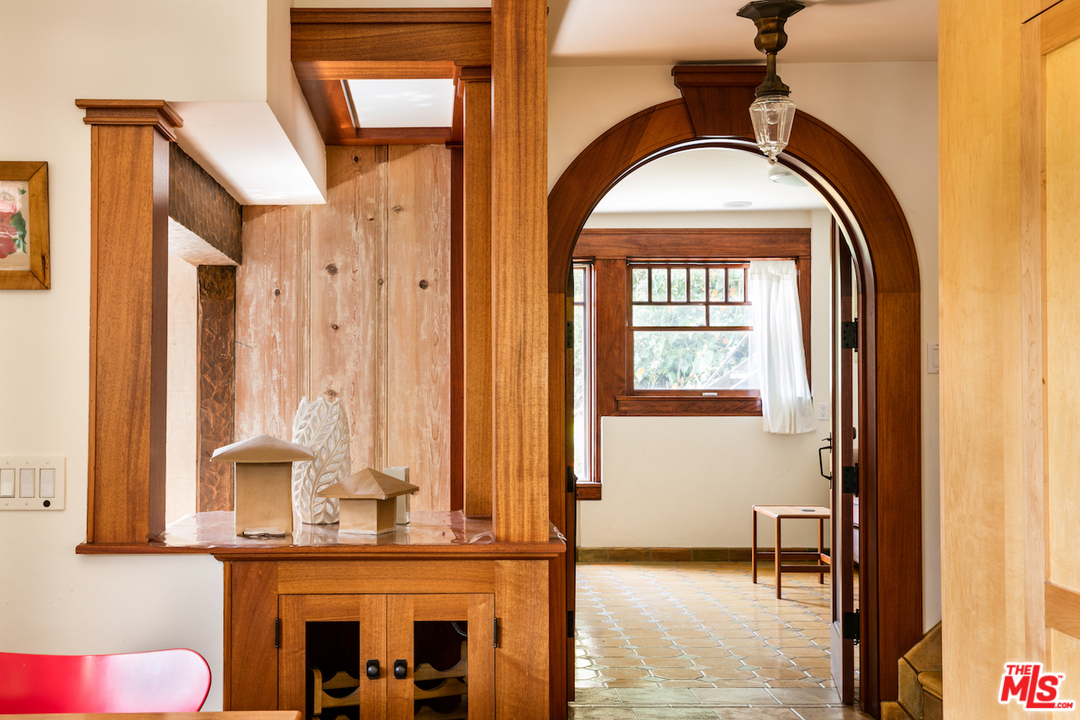 239 West Channel Road Santa Monica, CA 90402 - Photo 10 of 30 a view of front door with hallway and a potted plant