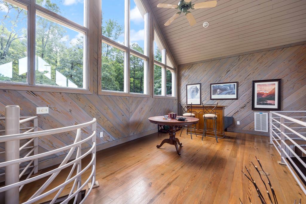 1140 Central Church Road Midland, GA 31820 - Photo 12 of 74 a living room with furniture a bed and a chandelier