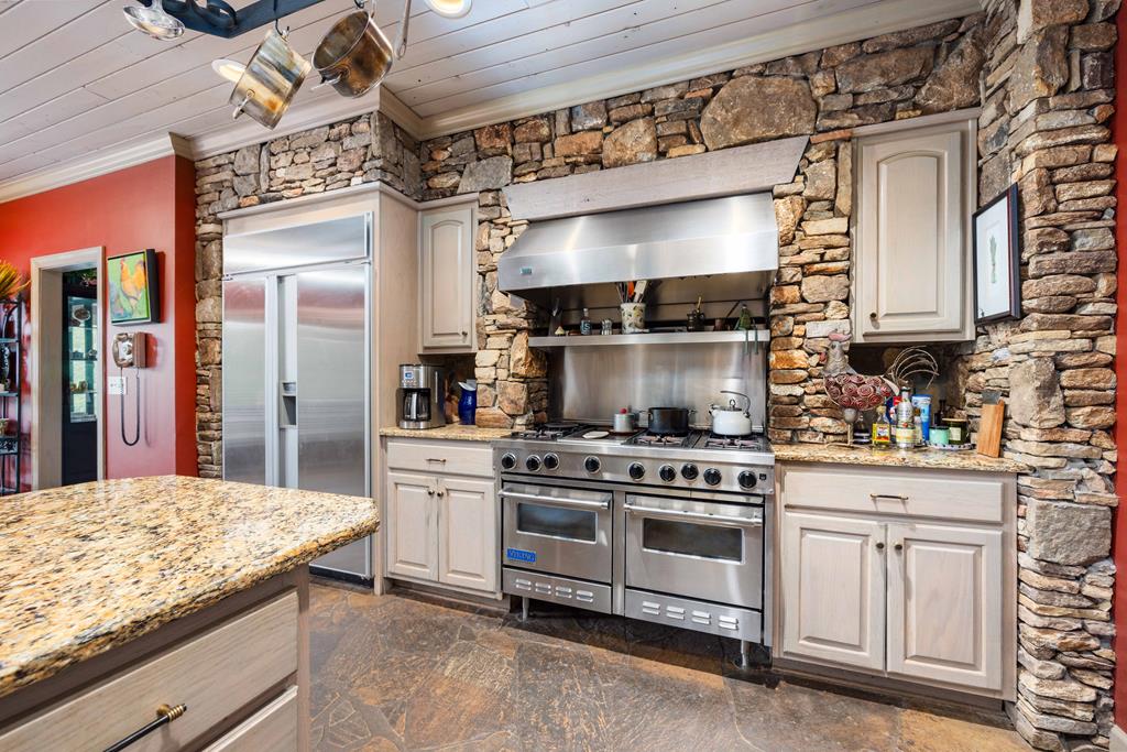 1140 Central Church Road Midland, GA 31820 - Photo 14 of 74 a kitchen with a stove and a white cabinets