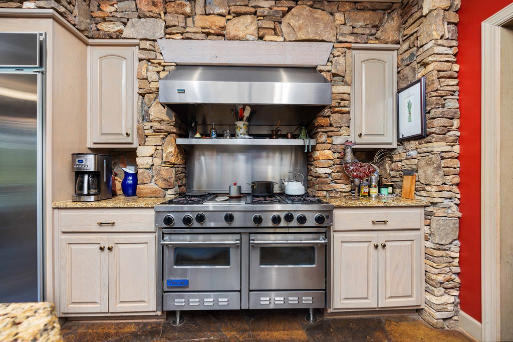 1140 Central Church Road Midland, GA 31820 - Photo 16 of 74 a stove top oven sitting inside of a kitchen