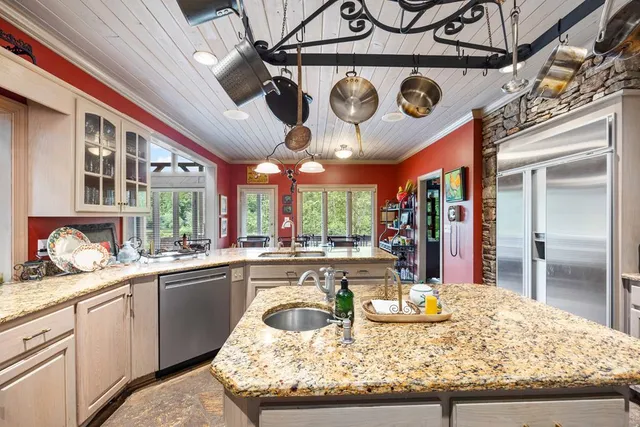 a view of a room with wooden floor and windows