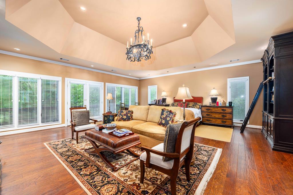 1140 Central Church Road Midland, GA 31820 - Photo 20 of 74 a living room with furniture and a chandelier