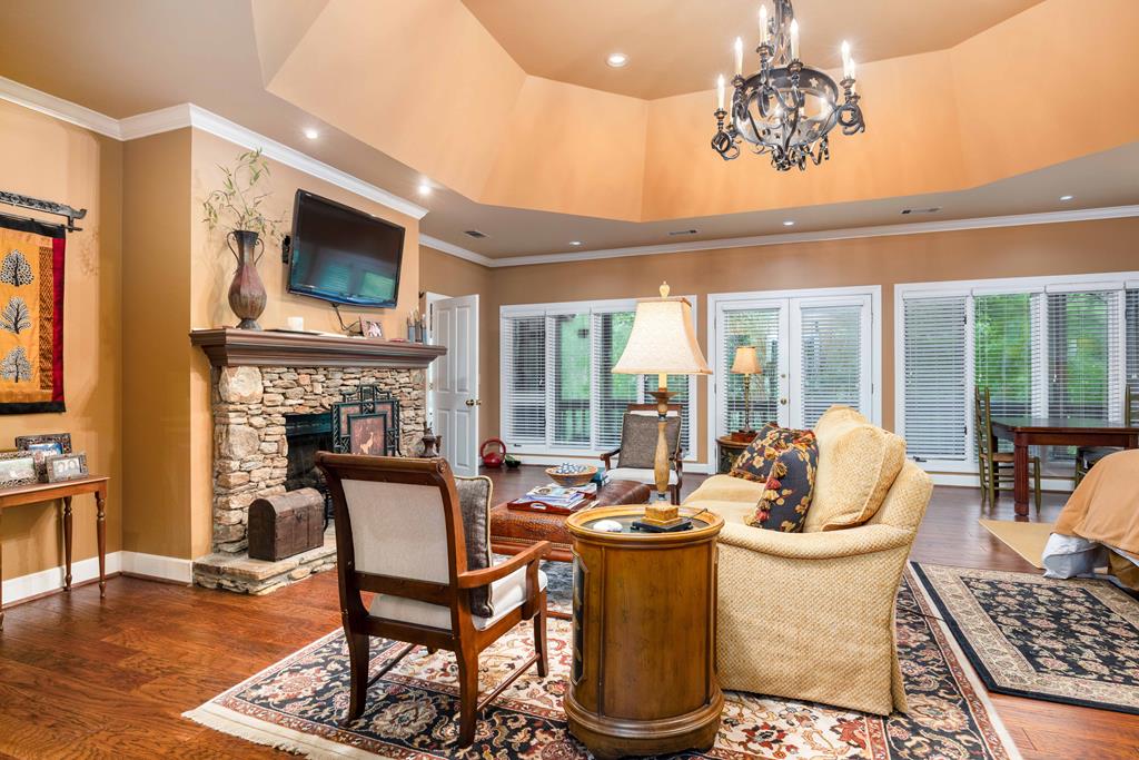 1140 Central Church Road Midland, GA 31820 - Photo 21 of 74 a view of a dining room with furniture wooden floor and chandelier