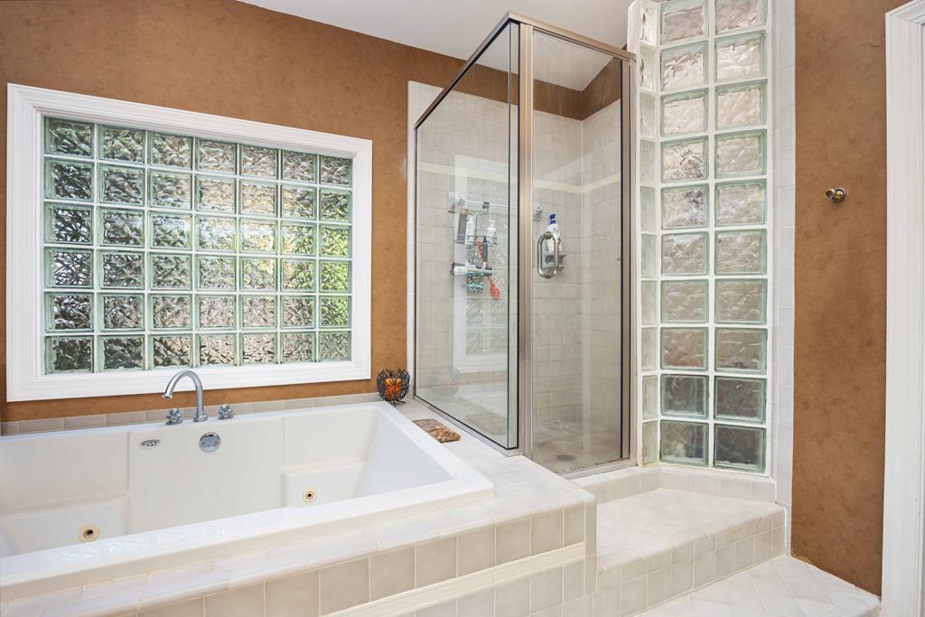 1140 Central Church Road Midland, GA 31820 - Photo 25 of 74 a bathroom with a bathtub and a shower