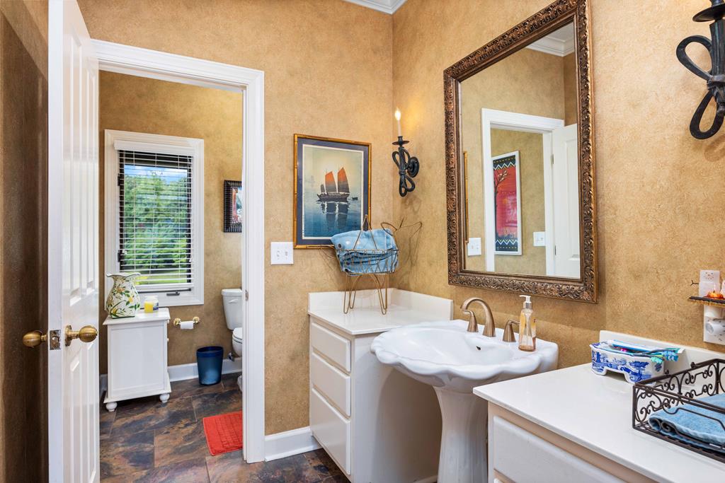 1140 Central Church Road Midland, GA 31820 - Photo 33 of 74 a en suite bathroom with a sink and a mirror