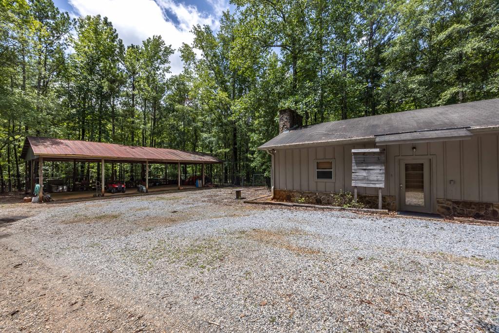 1140 Central Church Road Midland, GA 31820 - Photo 53 of 74 a backyard of a house with large trees and table