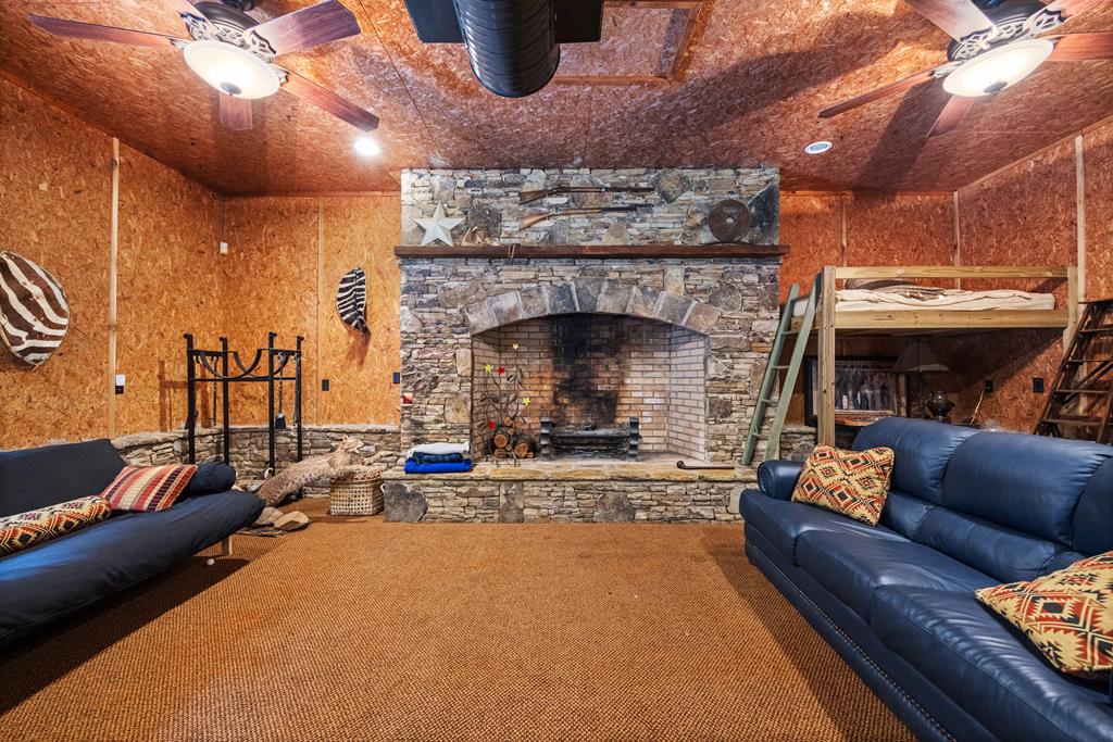 1140 Central Church Road Midland, GA 31820 - Photo 54 of 74 a living room with furniture and a fireplace