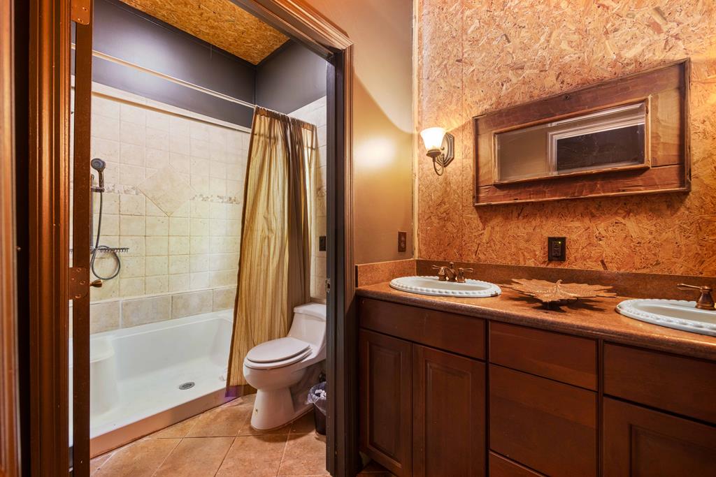 1140 Central Church Road Midland, GA 31820 - Photo 58 of 74 a bathroom with a sink a toilet and shower