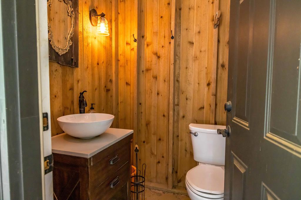 1140 Central Church Road Midland, GA 31820 - Photo 63 of 74 a bathroom with a granite countertop sink and a toilet