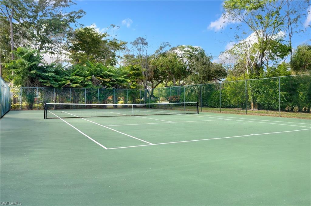 1814 Kings Lake Boulevard, Unit 201 Naples, FL 34112 - Photo 18 of 18 a view of a tennis court