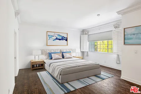 a bedroom with bed and a window