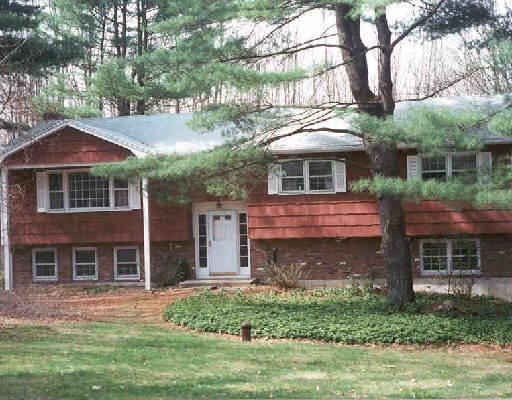 115 Bagburn Hill Road Monroe, CT 06468 - Photo 1 of 1 a front view of a house with a garden