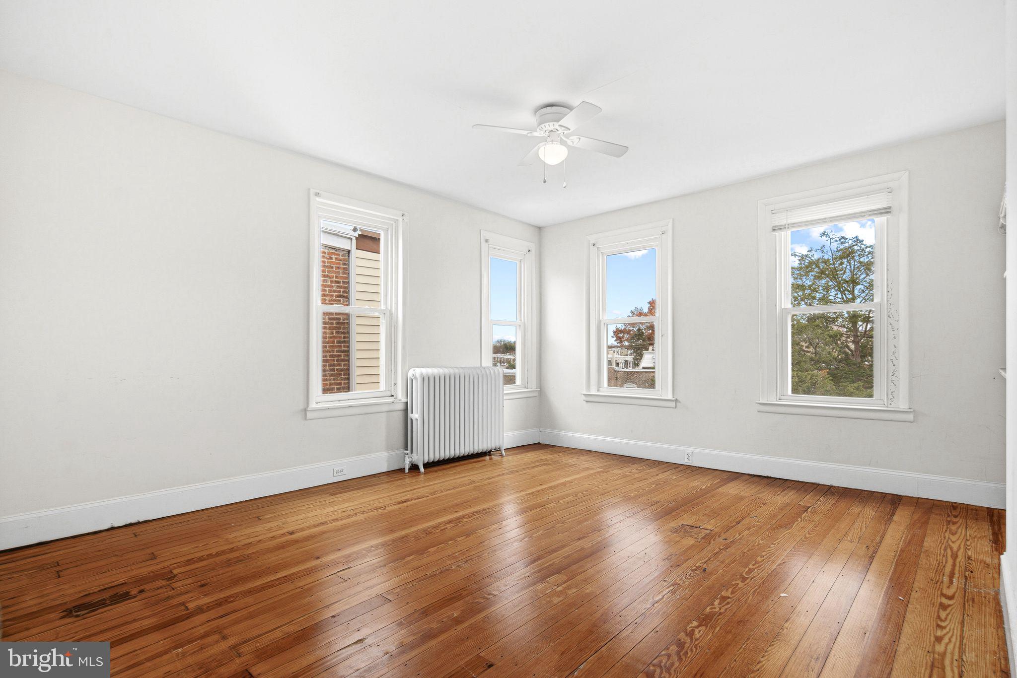 542 Martin Street Philadelphia, PA 19128 - Photo 10 of 16 a view of an empty room with wooden floor and a window