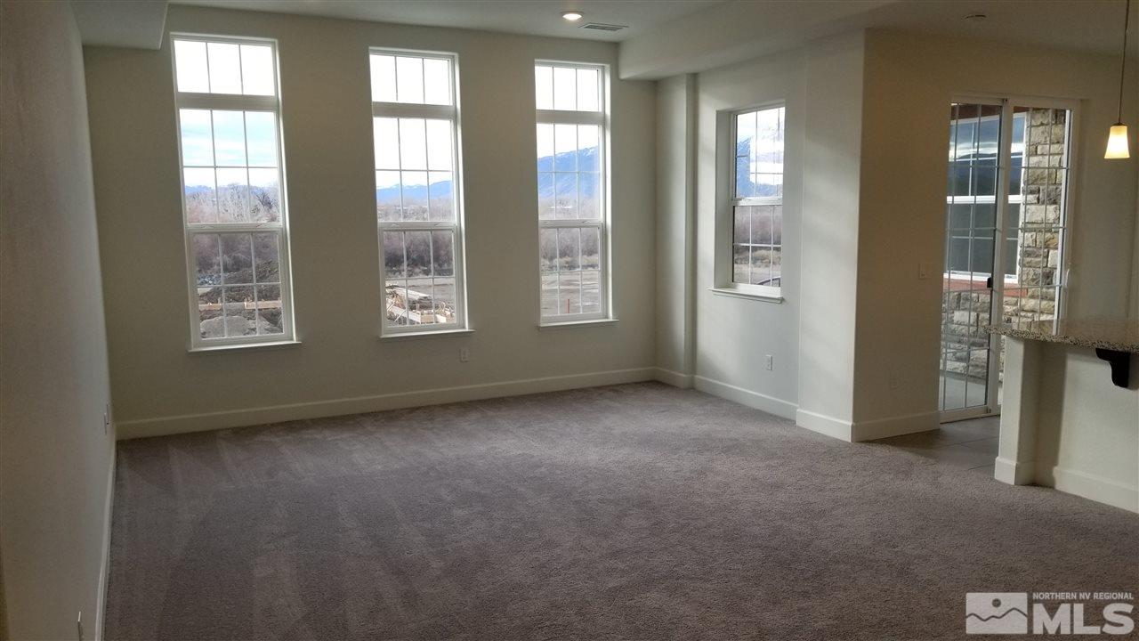 1885 Sea Horse Road, Unit C Reno, NV 89521 - Photo 2 of 9 an empty room with windows