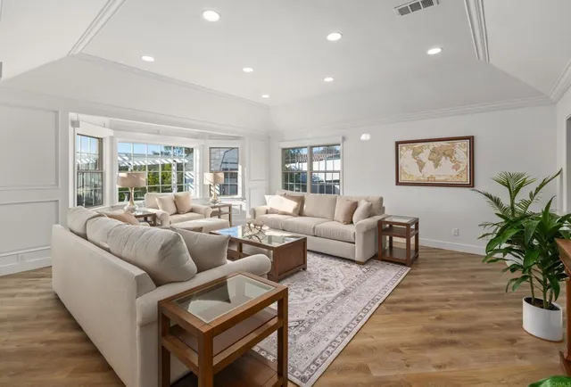 a living room with furniture and a table