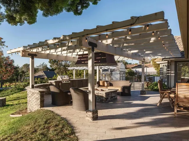 a spacious bedroom with a bed and a chandelier