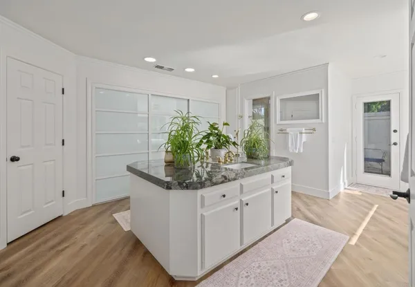 a bedroom with a bed and a table