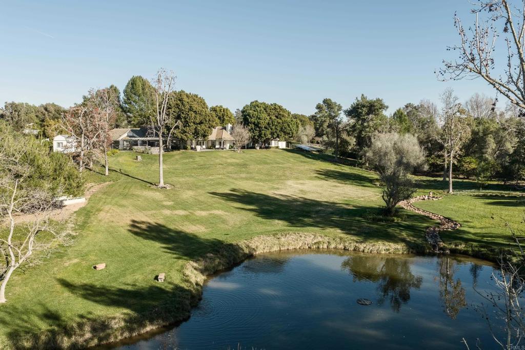 9 Country Glen Road Fallbrook, CA 92028 - Photo 36 of 74 a view of a lake in between two trees