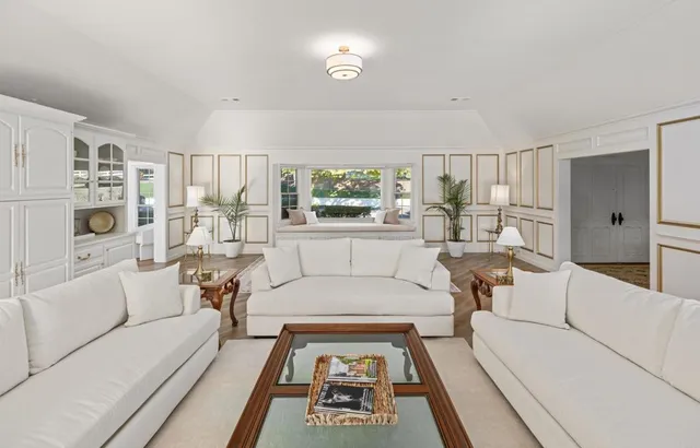 a view of a patio with table and chairs and potted plants