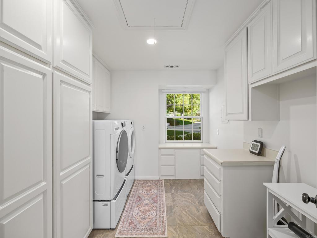 9 Country Glen Road Fallbrook, CA 92028 - Photo 50 of 74 a utility room with cabinets washer and dryer