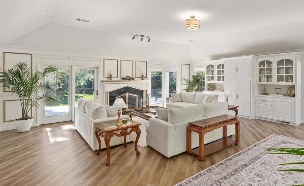 9 Country Glen Road Fallbrook, CA 92028 - Photo 5 of 74 a living room with furniture wooden floor and a fireplace