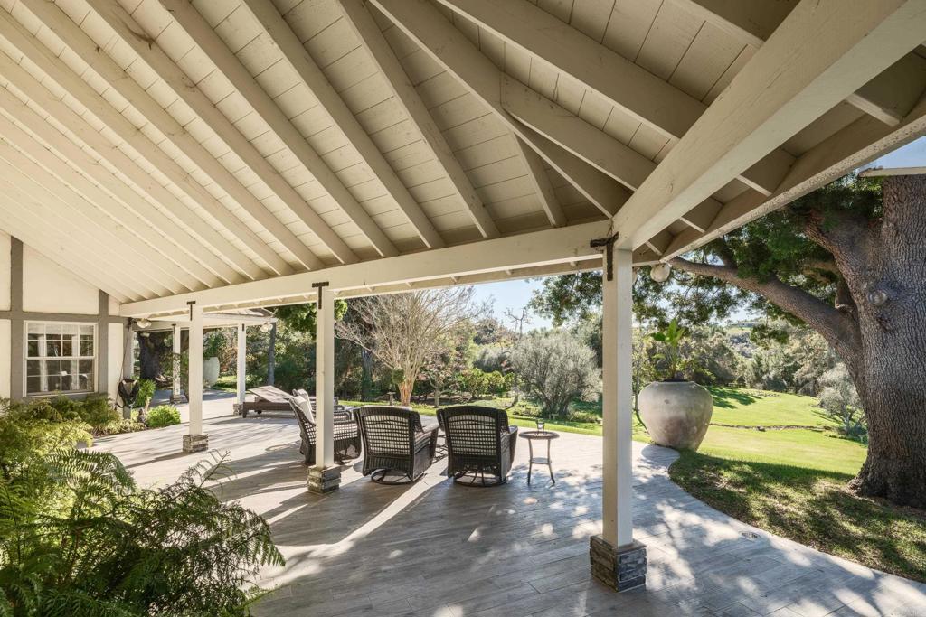 9 Country Glen Road Fallbrook, CA 92028 - Photo 59 of 74 a view of a patio with table and chairs potted plants and large tree