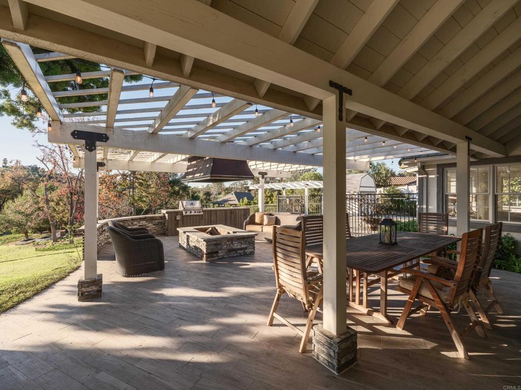9 Country Glen Road Fallbrook, CA 92028 - Photo 61 of 74 a view of a patio with table and chairs and potted plants