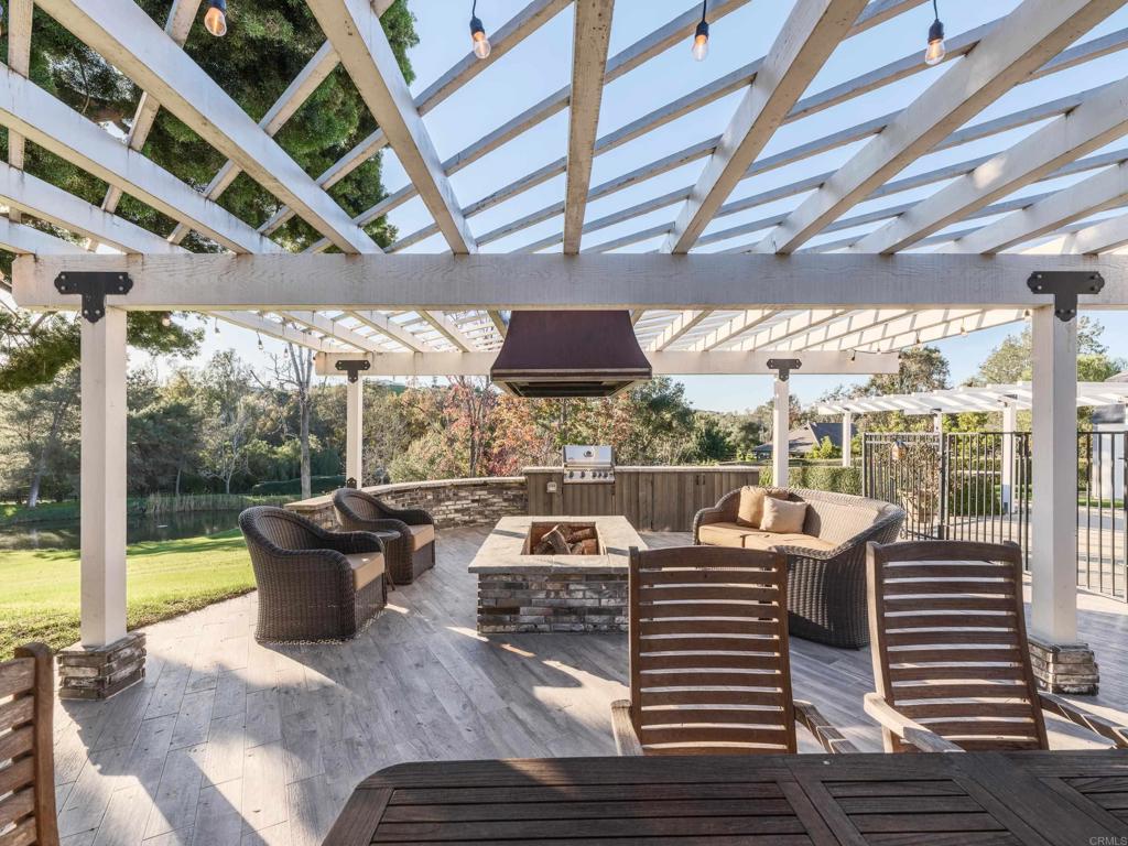9 Country Glen Road Fallbrook, CA 92028 - Photo 62 of 74 a view of a roof deck with couches and wooden floor