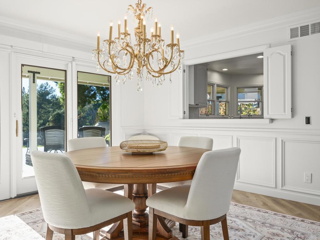 9 Country Glen Road Fallbrook, CA 92028 - Photo 9 of 74 a view of a dining room with furniture window and wooden floor