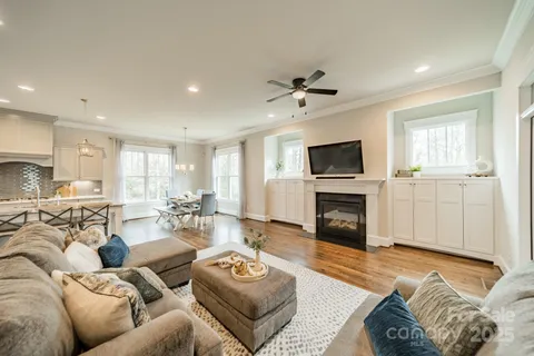 a living room with furniture flat screen tv and a fireplace