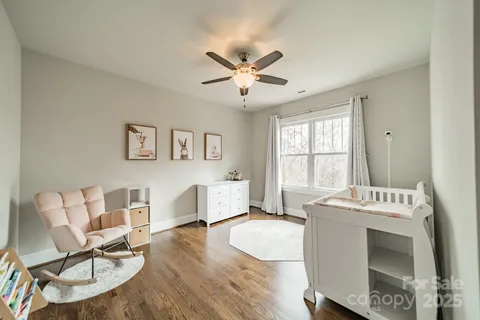 a view of a livingroom with furniture and a window