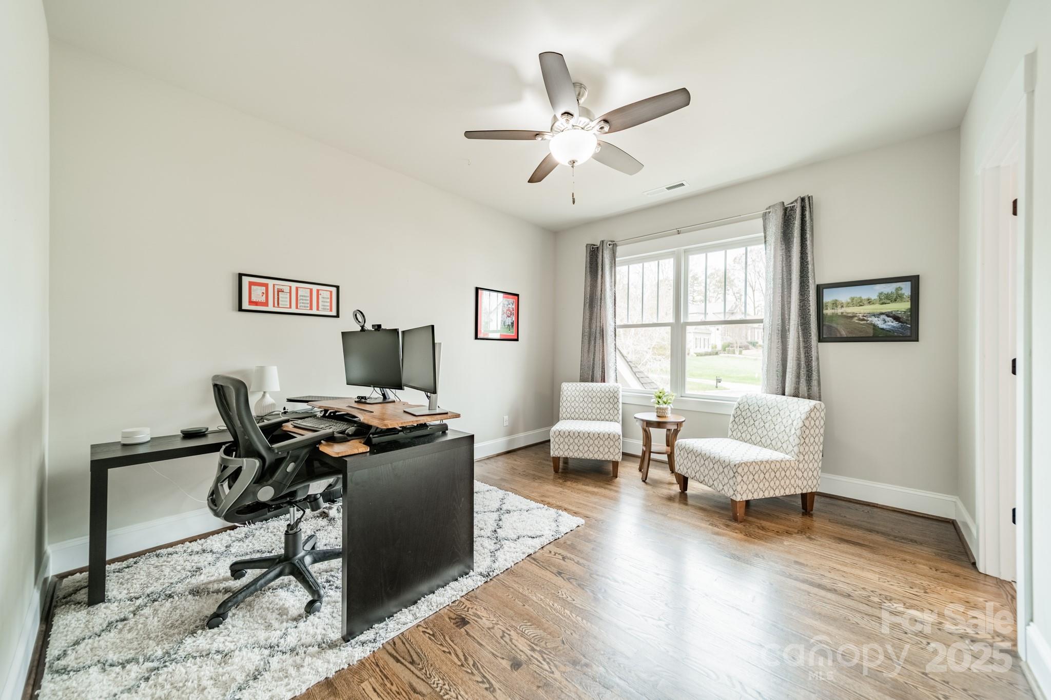348 Meares Court Fort Mill, SC 29715 - Photo 28 of 47 a workspace with wooden floor and a window