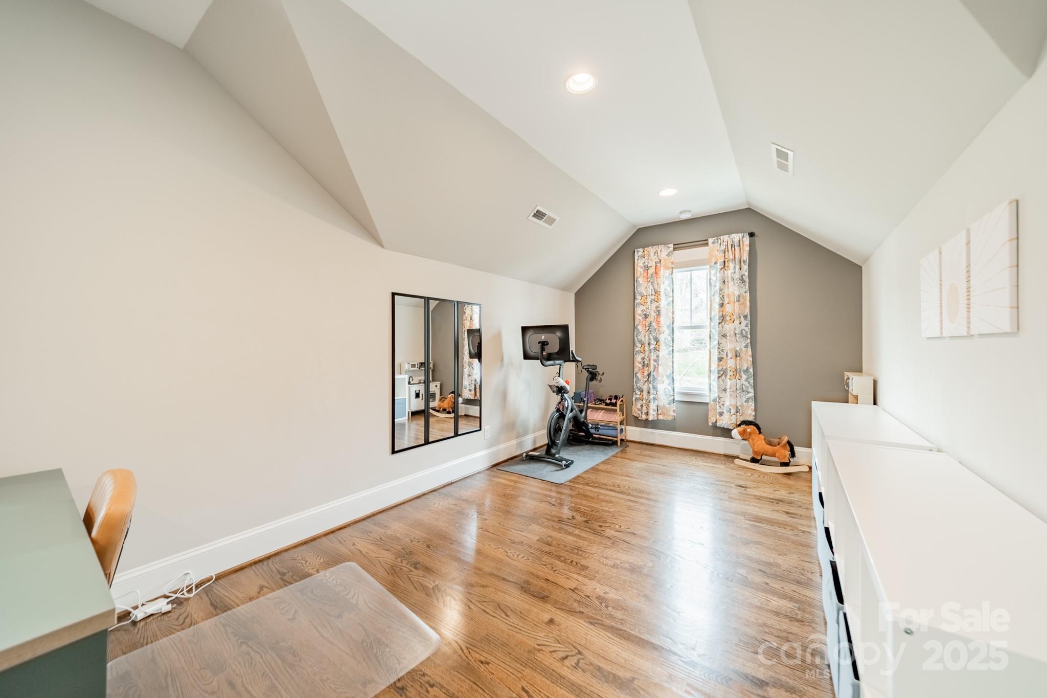 348 Meares Court Fort Mill, SC 29715 - Photo 31 of 47 a big room with wooden floor and windows