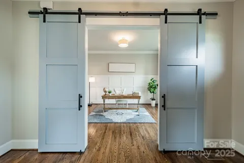 a view of a refrigerator in kitchen and wooden floor