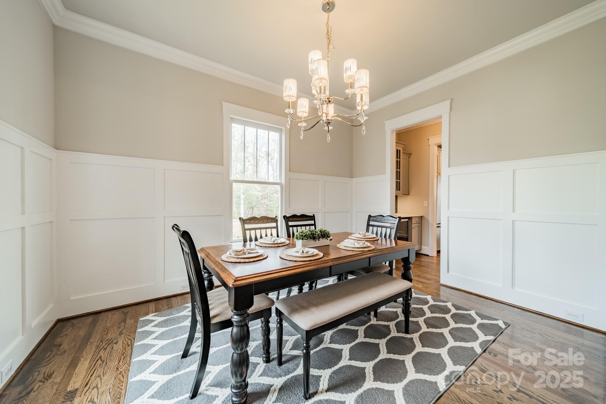 348 Meares Court Fort Mill, SC 29715 - Photo 10 of 47 a view of a dining room with furniture and chandelier