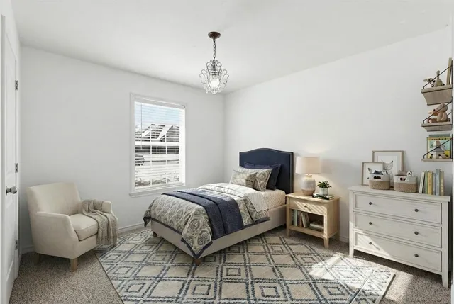 a spacious bedroom with a bed and a couch