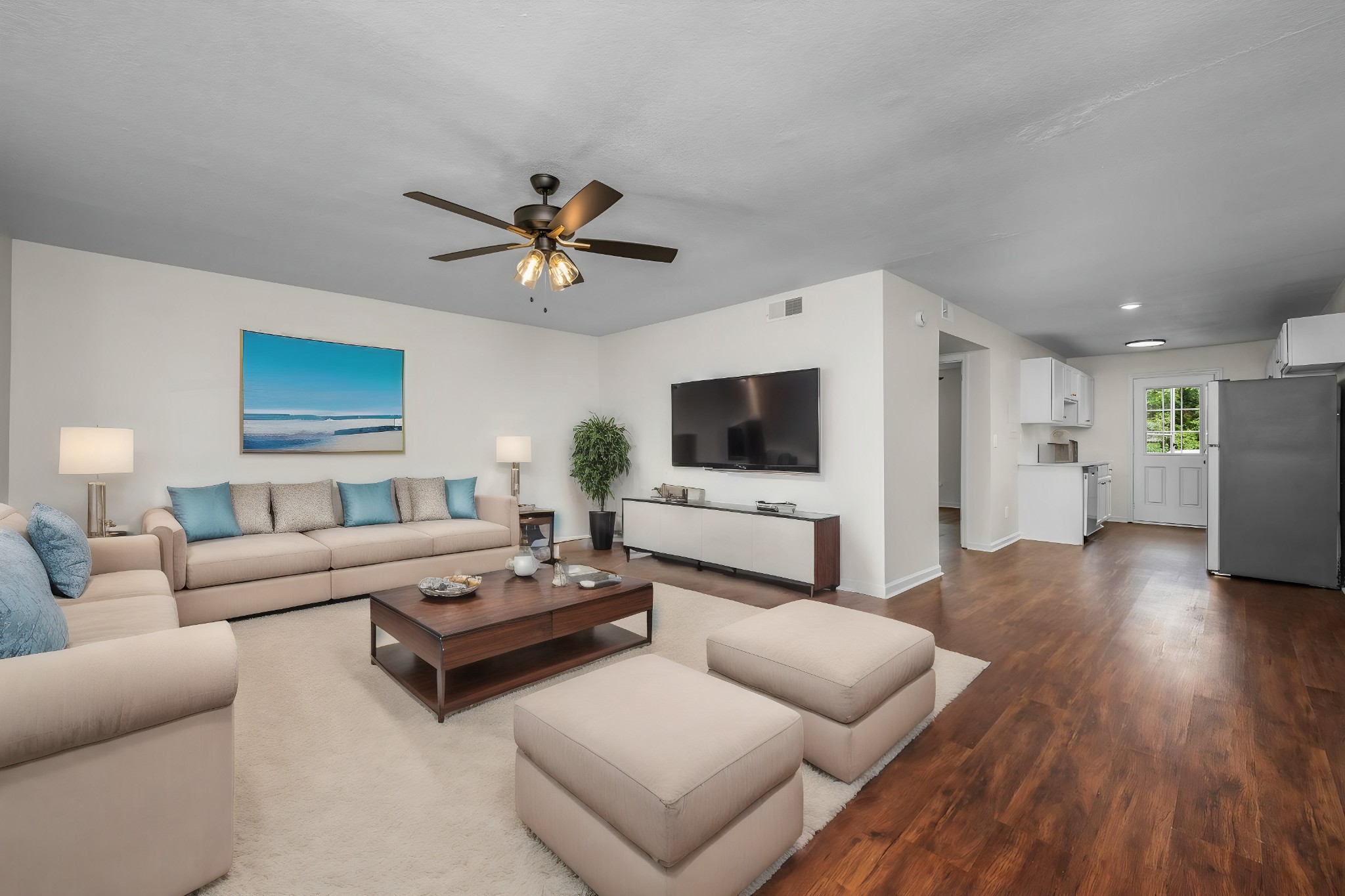a living room with furniture and a flat screen tv