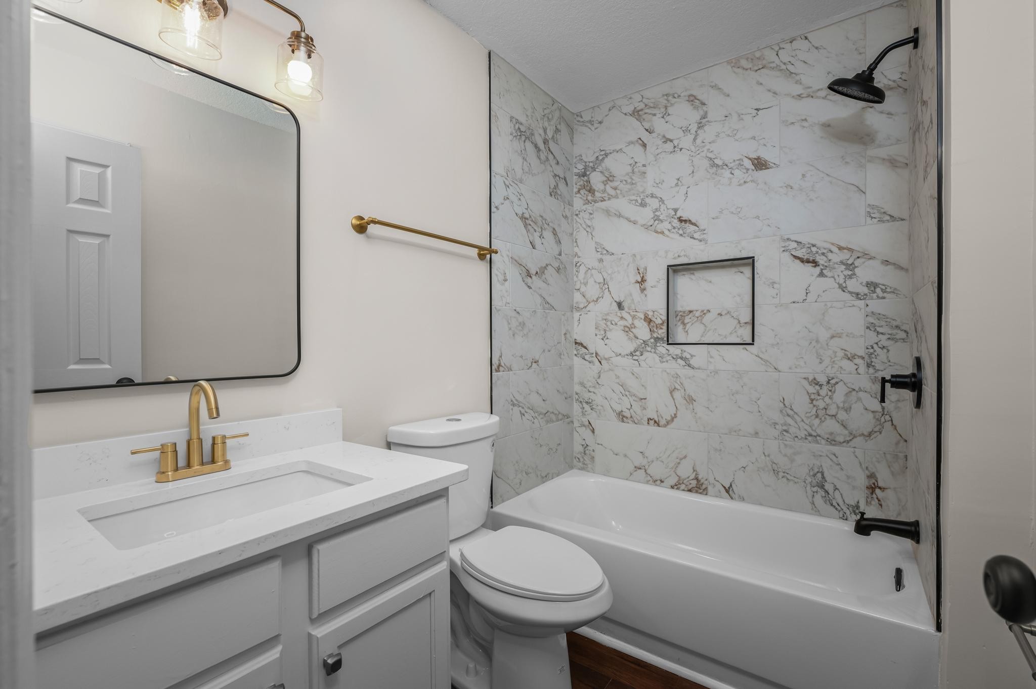 1301 Neelys Bend Road, Unit 30 Madison, TN 37115 - Photo 11 of 15 a bathroom with a sink toilet and shower