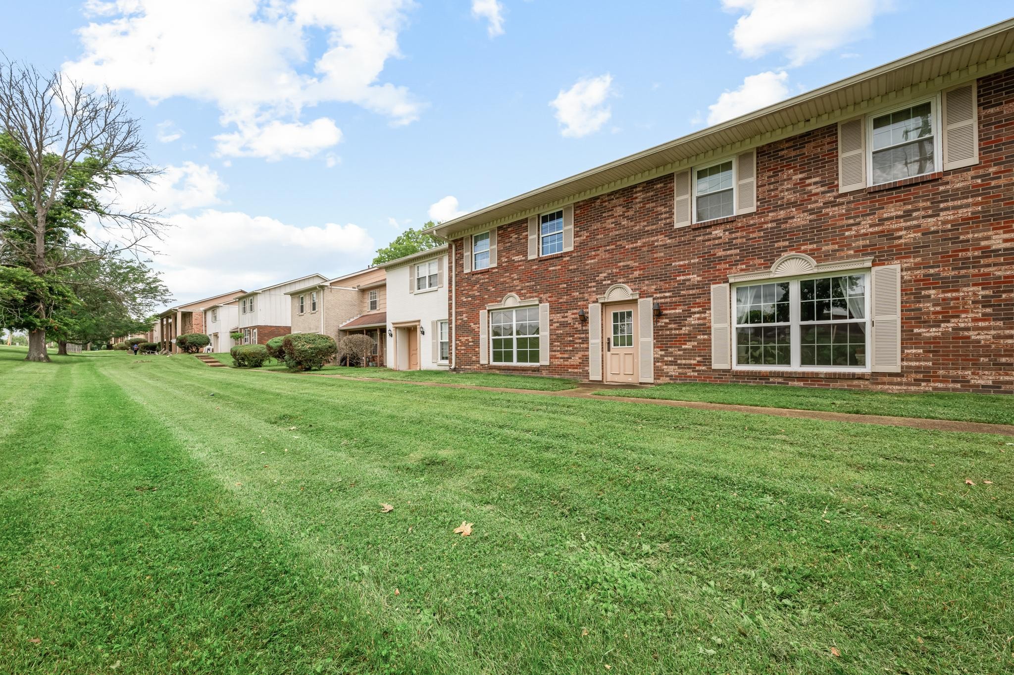 1301 Neelys Bend Road, Unit 30 Madison, TN 37115 - Photo 13 of 15 a view of a house with a yard