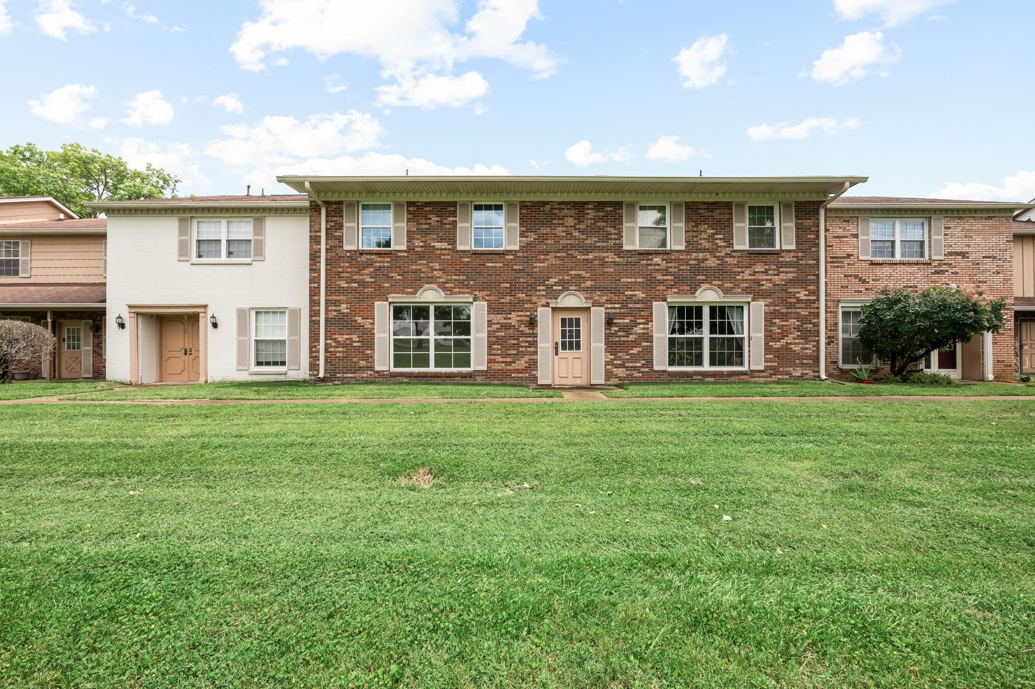 1301 Neelys Bend Road, Unit 30 Madison, TN 37115 - Photo 14 of 15 a view of a house with a yard