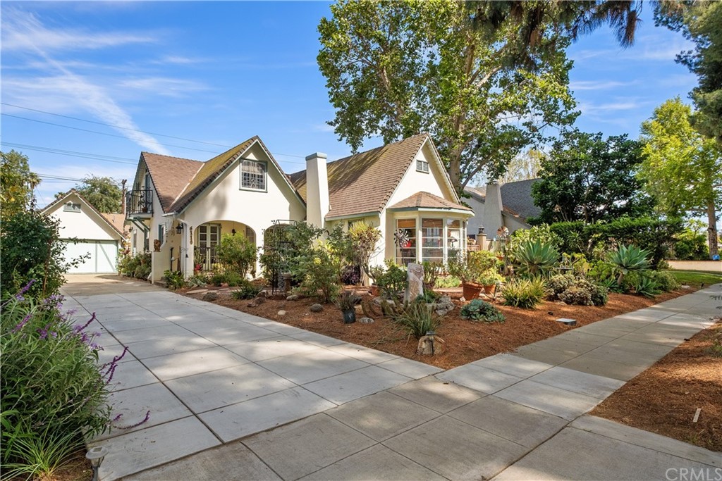 6110 Del Ray Court Riverside, CA 92506 - Photo 1 of 1 a front view of a house with a garden