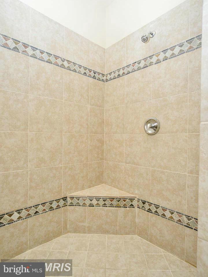 8536 Old Keene Mill Road Springfield, VA 22152 - Photo 25 of 30 a bathroom with a shower and a shower