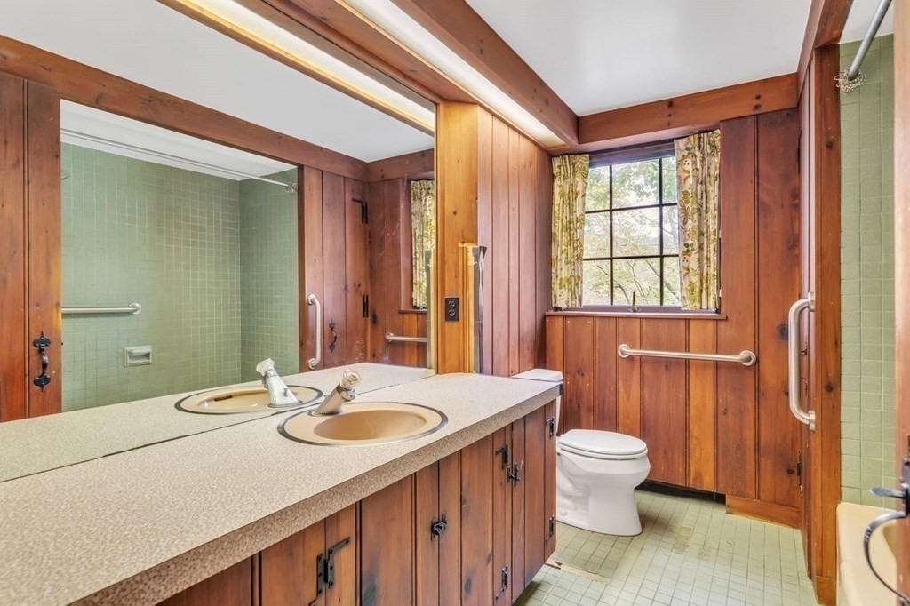 30 Green River Road Greenfield, MA 01301 - Photo 13 of 34 a bathroom with a double vanity sink toilet and a mirror