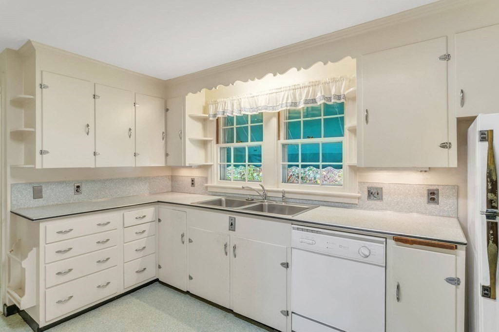 30 Green River Road Greenfield, MA 01301 - Photo 15 of 34 a kitchen with granite countertop white cabinets and a sink
