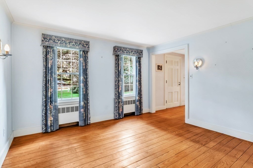30 Green River Road Greenfield, MA 01301 - Photo 18 of 34 a view of an empty room with wooden floor and a window
