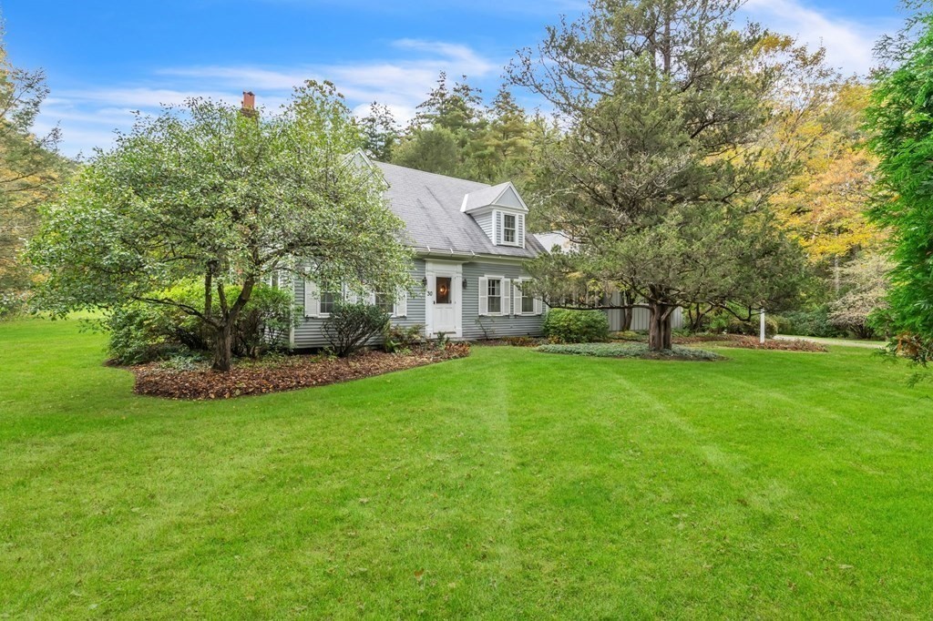 30 Green River Road Greenfield, MA 01301 - Photo 2 of 34 a view of a house with a big yard potted plants and large tree